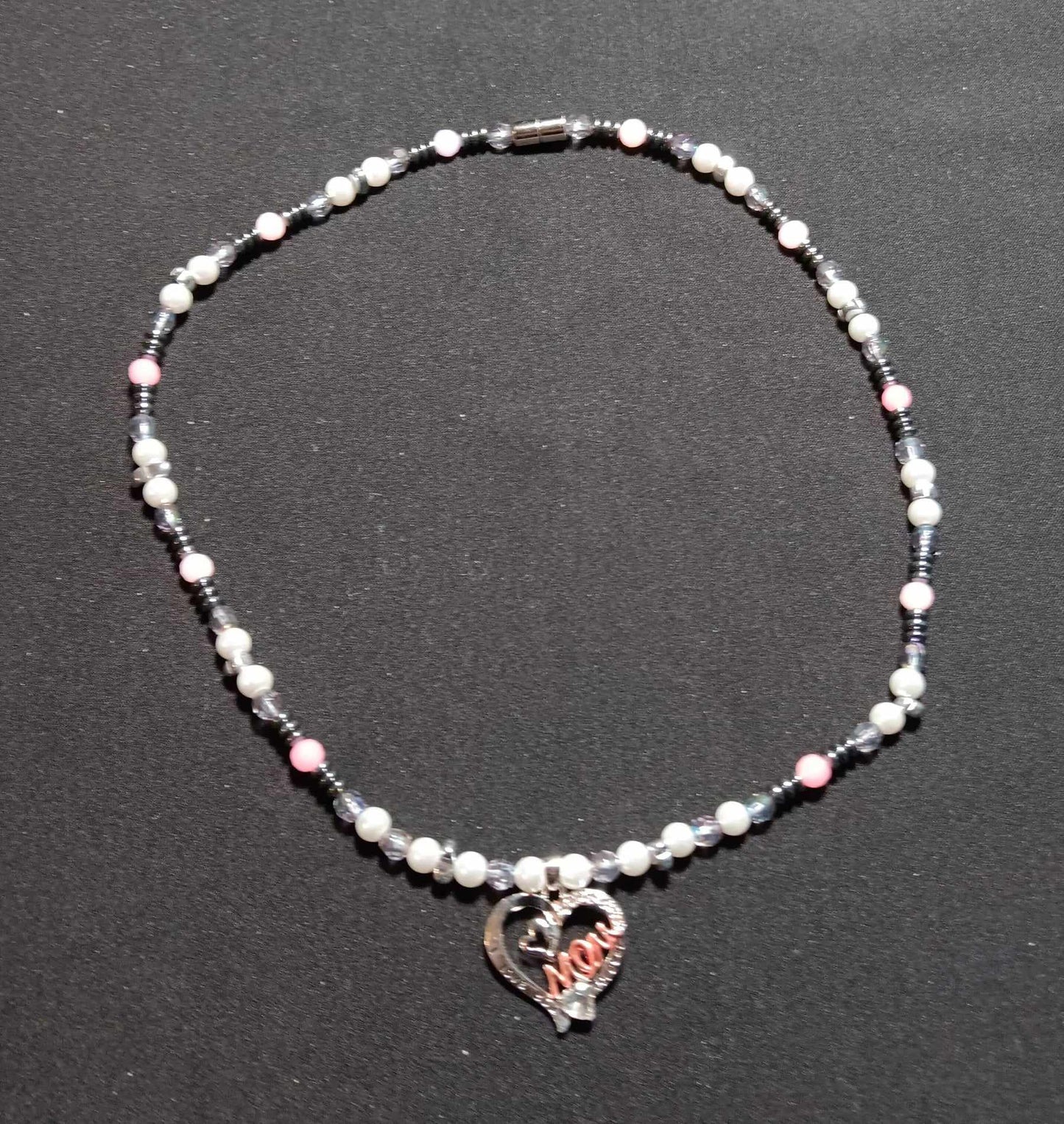 White beaded necklace with hematite