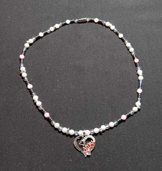 White beaded necklace with hematite